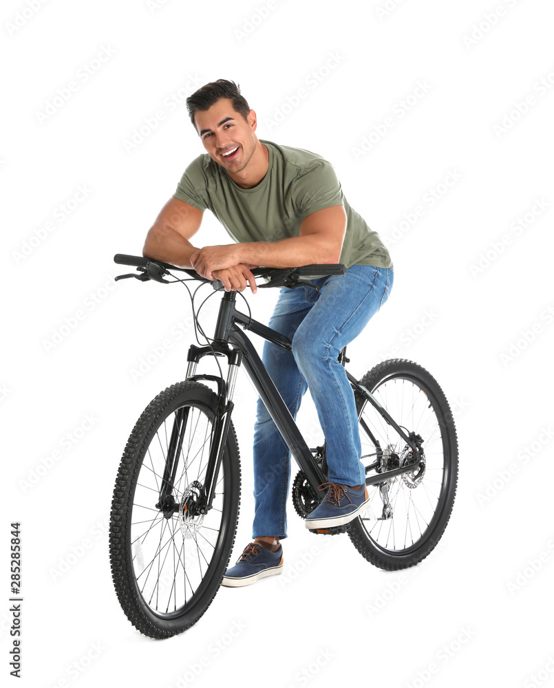 Naklejka premium Handsome young man with modern bicycle on white background