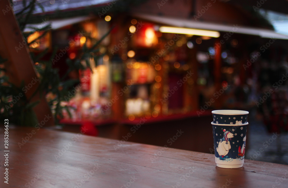 single use mulled wine cups in christmas market. pollution crisis concept single use mulled wine cups in christmas market. pollution crisis concept