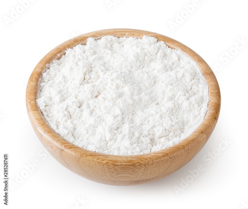 White wheat flour in wooden bowl isolated on white background with clipping path