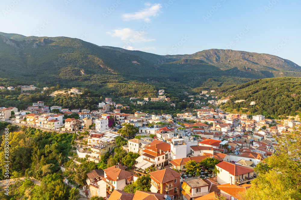 Parga town roofs at sunset. View from old castle. Summer season at popular greek resort. Greece.