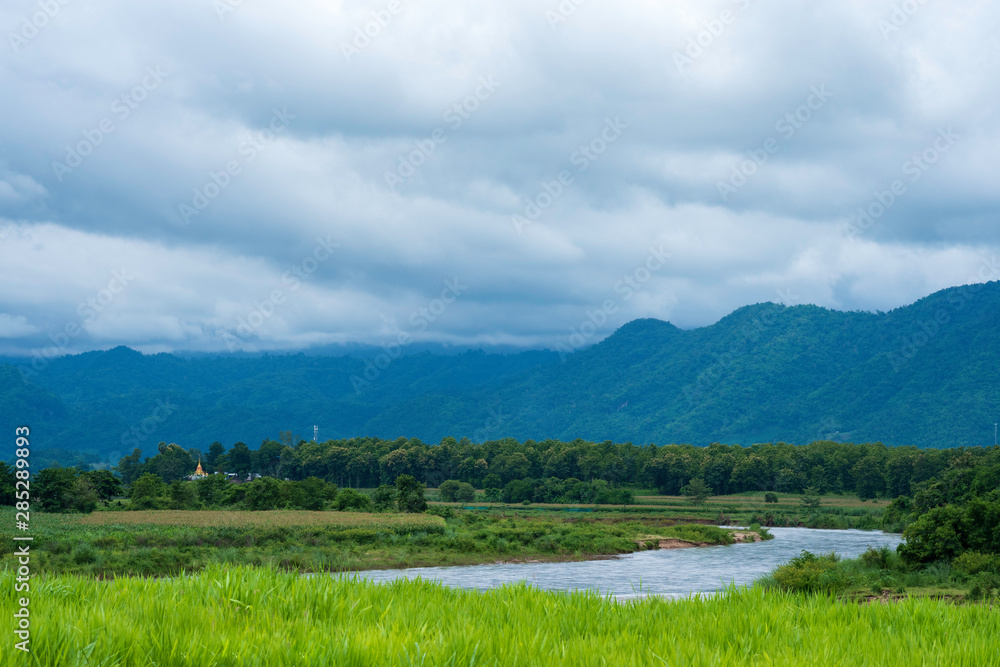 Beautiful Moei River interspersed with trees and mountains, View from Thailand.