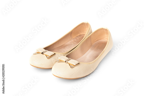 Beige ballet flats isolated on white background.