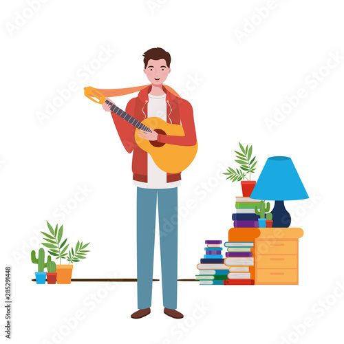 man with acoustic guitar in living room