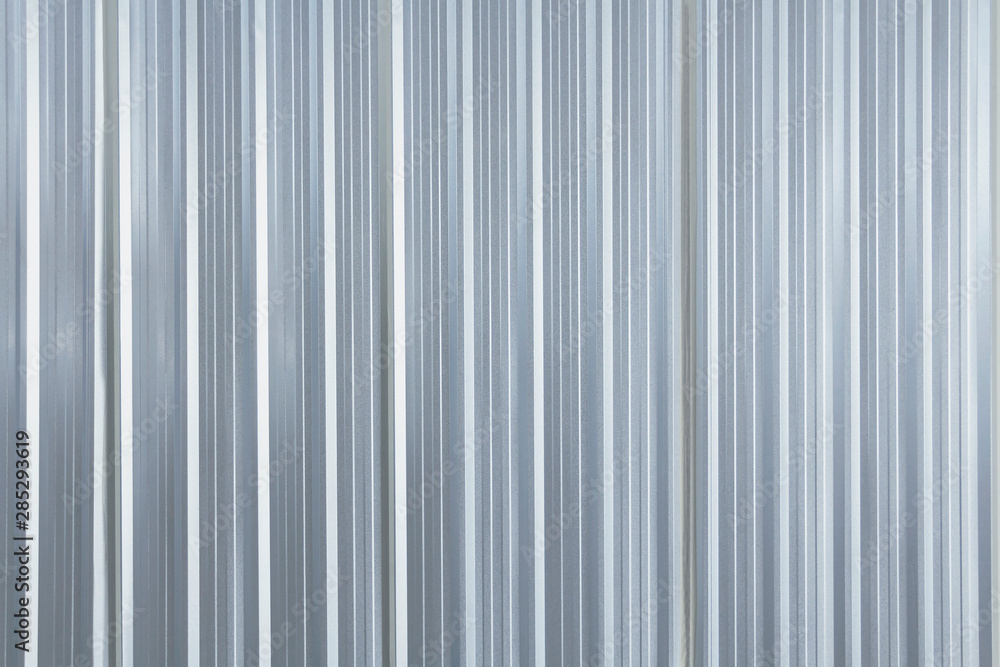 Metal plate sheet fence seamless surface of galvanized steel texture corrugated for wall in a construction site and Industrial building. Metal plate sheet fence seamless surface of galvanized steel texture corrugated for wall in a construction site and Industrial building.