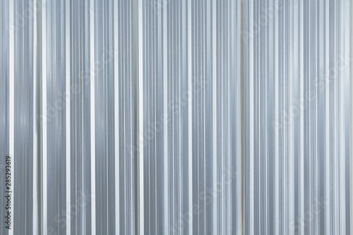 Fototapeta Naklejka Na Ścianę i Meble -  Metal plate sheet fence seamless surface of galvanized steel texture corrugated for wall in a construction site and Industrial building.