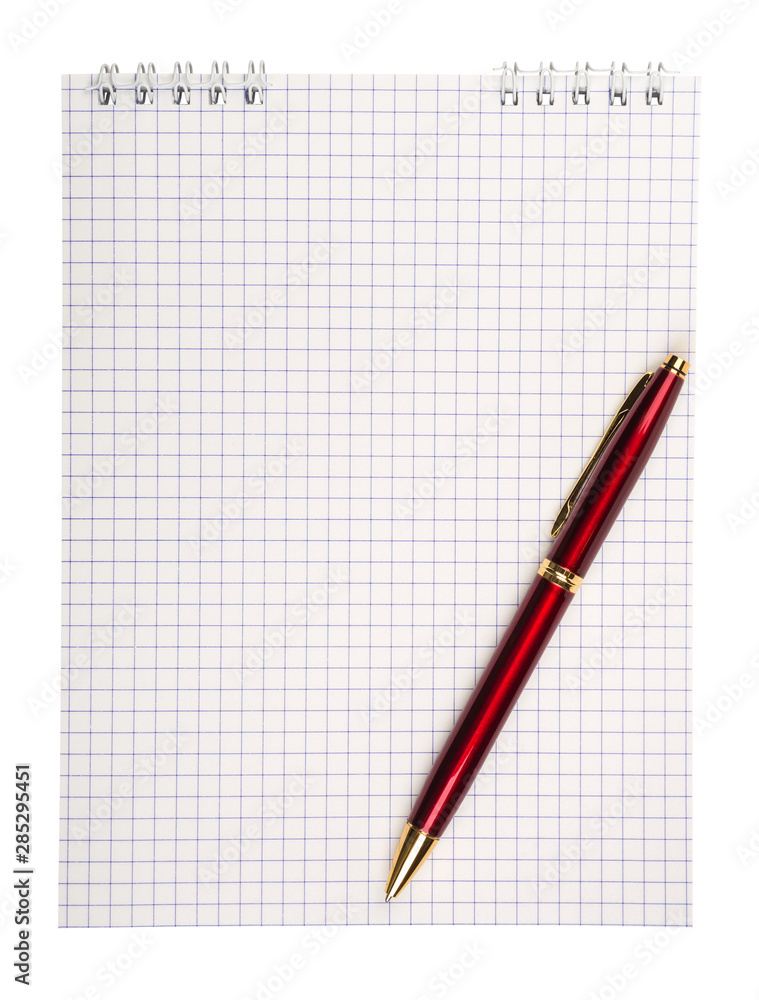 Spiral notepad with squared paper and pen isolated on white Spiral notepad with squared paper and pen isolated on white