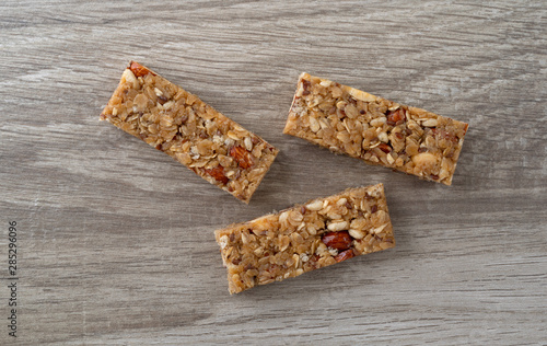 Принти на полотні Three flax and almond seed granola bars on a table
