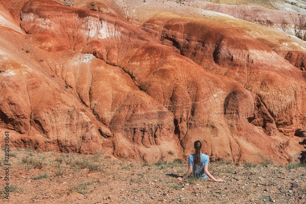 Woman in valley of Mars landscapes in the Altai Mountains, Kyzyl Chin, Siberia, Russia Woman in valley of Mars landscapes in the Altai Mountains, Kyzyl Chin, Siberia, Russia