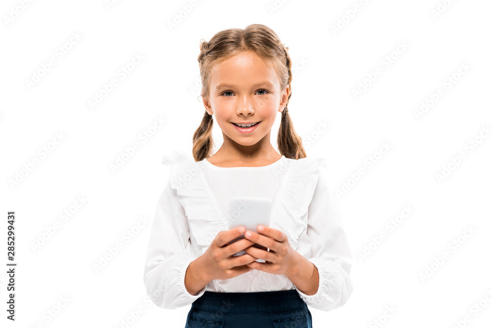cheerful child using smartphone isolated on white cheerful child using smartphone isolated on white