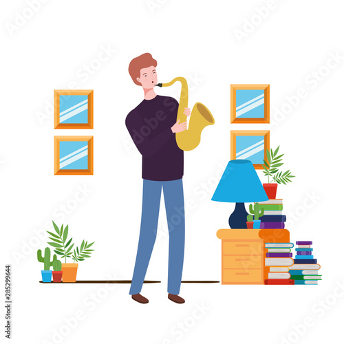 young man with saxophone in living room