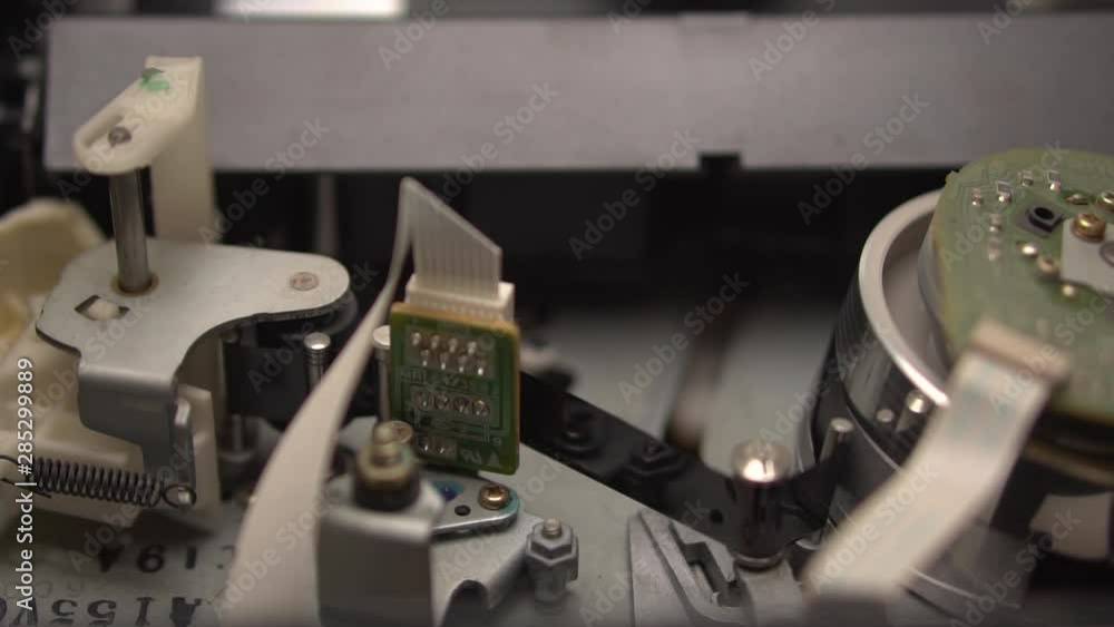 VCR cassette mechanism. Closeup. Rewind of videotape in the