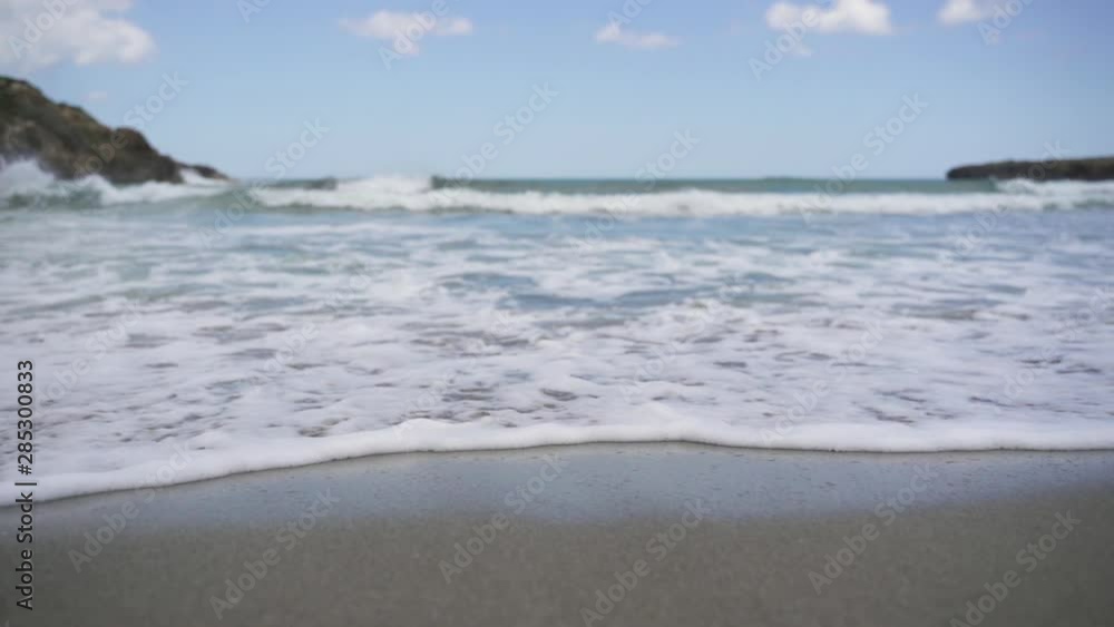 Sea waves crashing on beach shore in slow motion Sea waves crashing on beach shore in slow motion