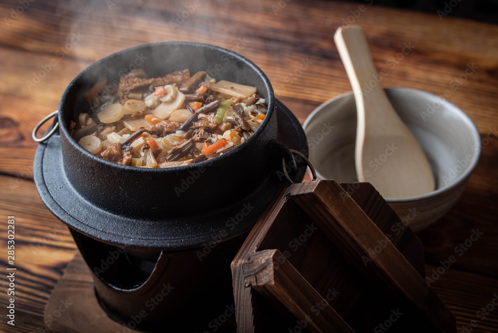 Kamameshi, japanese pot rice with autumn ingredients Photos | Adobe Stock
