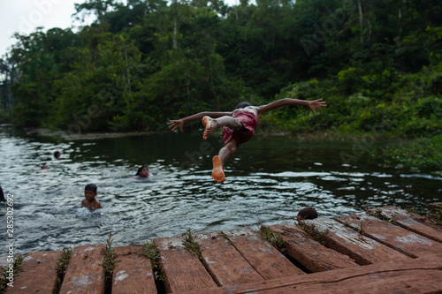 Children playing in a river in the Amazon, Pará - Brazil photo