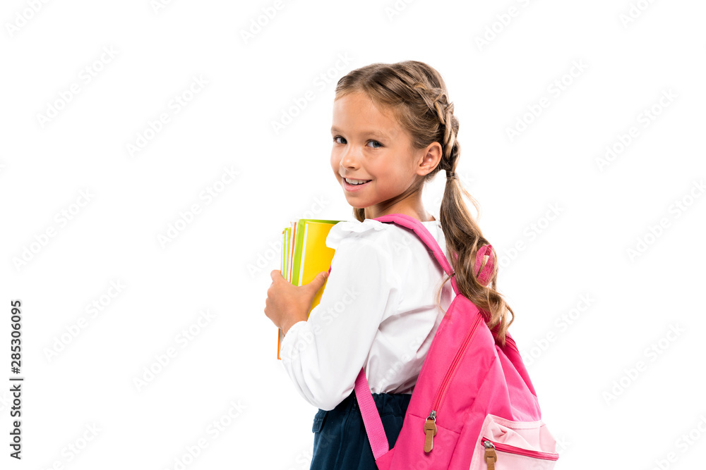 smiling child standing with pink backpack and books isolated on white smiling child standing with pink backpack and books isolated on white