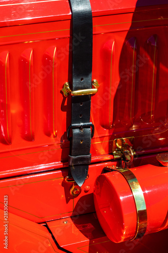 red Vintage old car exterior detail - side strap