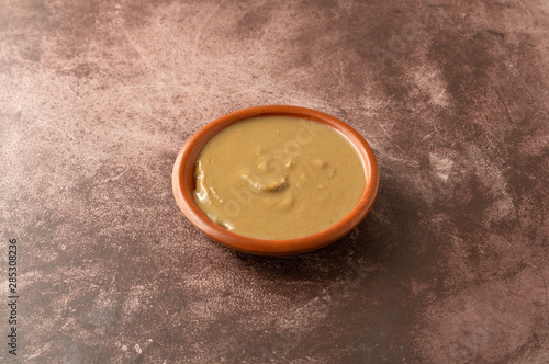 Organic cashew nut butter in a bowl on a table