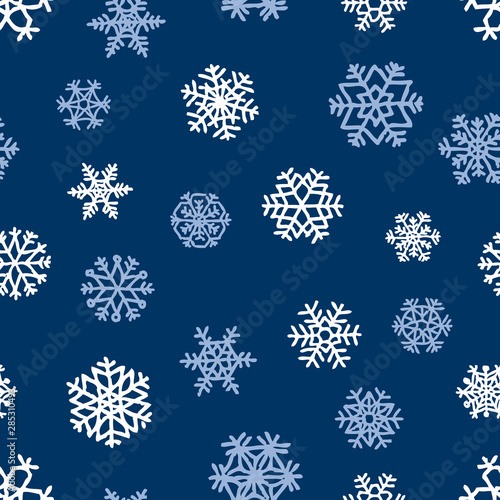 Seamless background of different stylized snowflakes