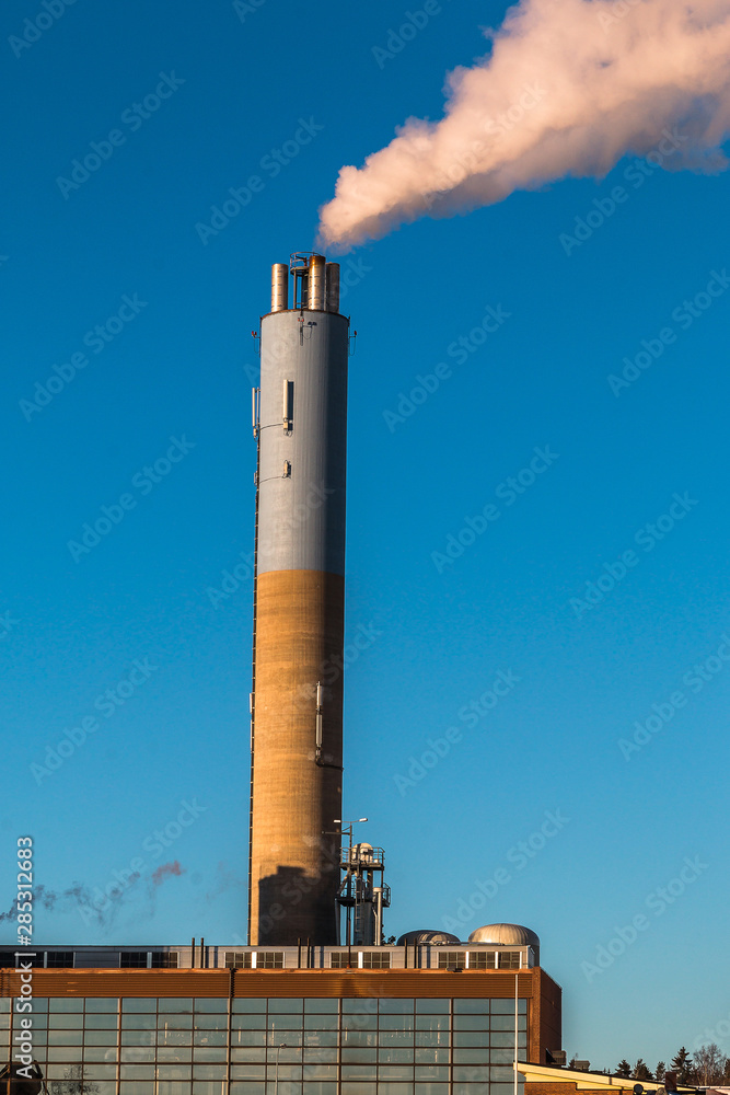 Environmental pollution concept. Pollution and smoke from chimneys of factory or power plant. Environmental pollution concept. Pollution and smoke from chimneys of factory or power plant.