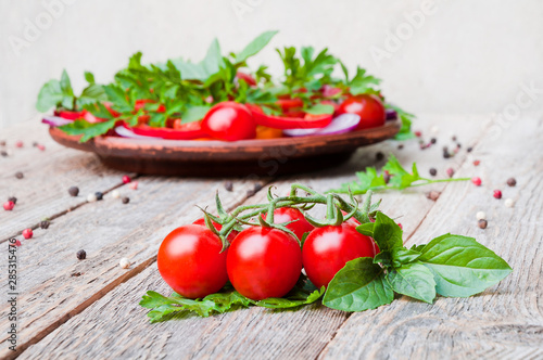 Fresh ripe tomatoes on a wooden table