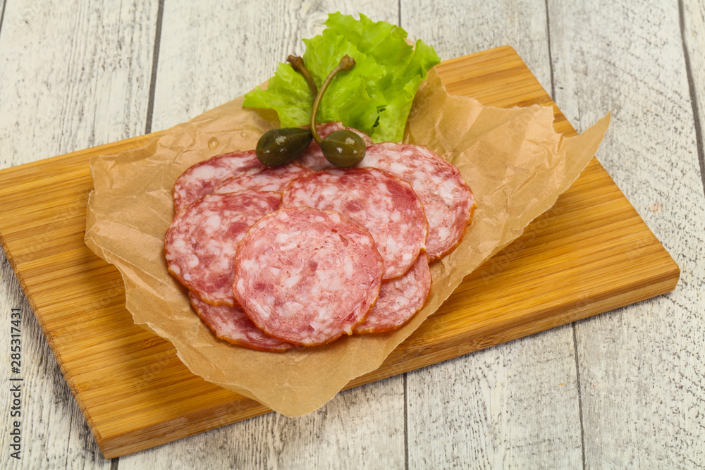 Spanish Salchichon sausage with salad Spanish Salchichon sausage with salad