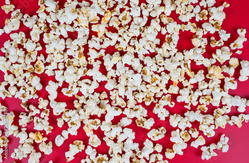 Top above high angle overhead closeup view photo of tasty popcorn isolated over vivid color background