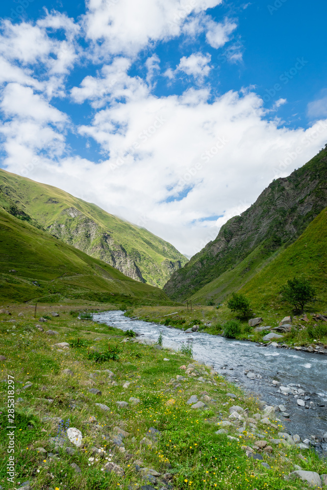 Mountain region landscape in Kazbegi, Georgia - Dramatic landscape of popular adventure trekking and hiking region in the Caucasus. 