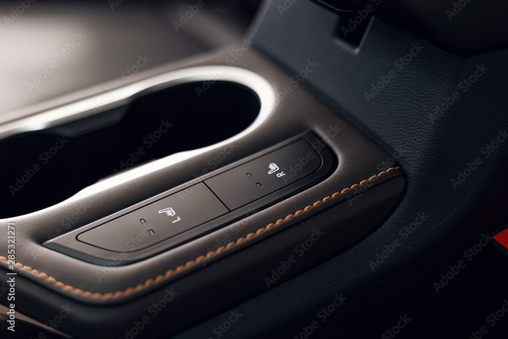 Modern car interior. Soft focus. Modern car illuminated dashboard. Luxurious car instrument cluster. Close up shot of automobile instrument panel. Blue interior light Modern car interior. Soft focus. Modern car illuminated dashboard. Luxurious car instrument cluster. Close up shot of automobile instrument panel. Blue interior light