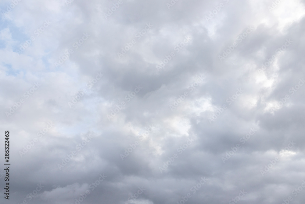 The sky is overcast. You can see light and dark clouds. Cloudy weather before the rain. Textural background with free space and empty space.