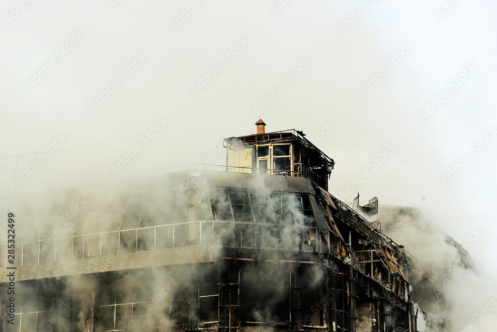 Fototapeta premium shopping center or mall fire,smoke,fighters,space for copy or text,toned photo