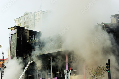 shopping center or mall fire,smoke,fighters,space for copy or text,toned photo