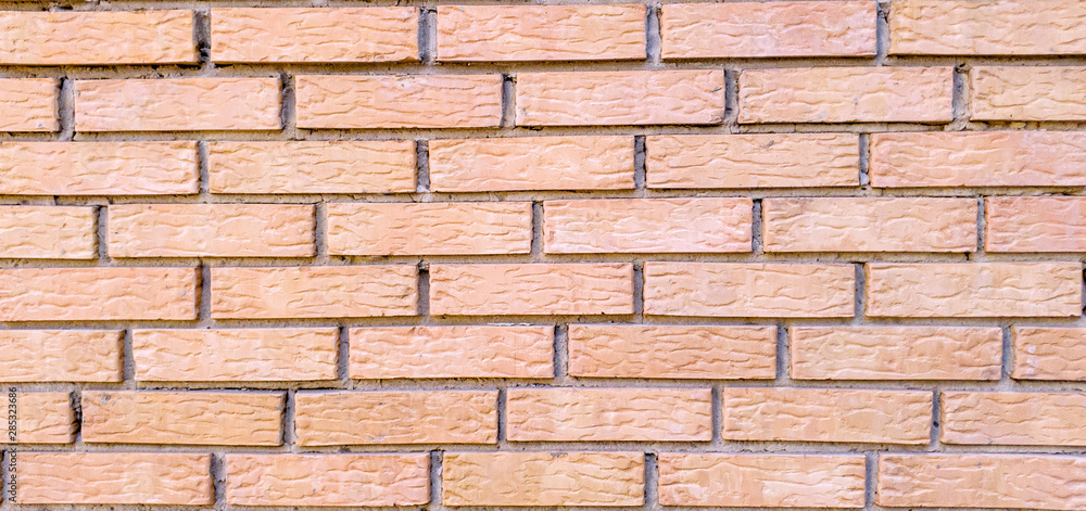 Seamless background of pink bricks for decoration of advertising banners and other design purposes Seamless background of pink bricks for decoration of advertising banners and other design purposes