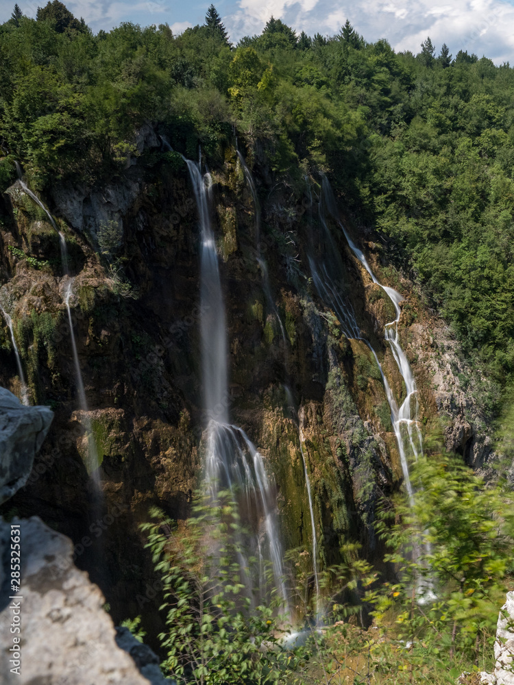 Obraz premium Plitvice Lakes, Croatia, august 2019: The highest waterfall in Croatia, in Plitvicka Jezera UNESCO National park