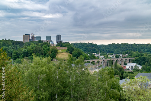 Panoramic view with railway viaduct and skyscrapers in Luxembourg city.