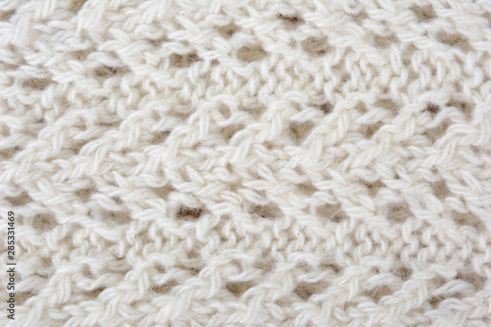 White knitted texture fragment. Handmade women hobby White knitted texture fragment. Handmade women hobby