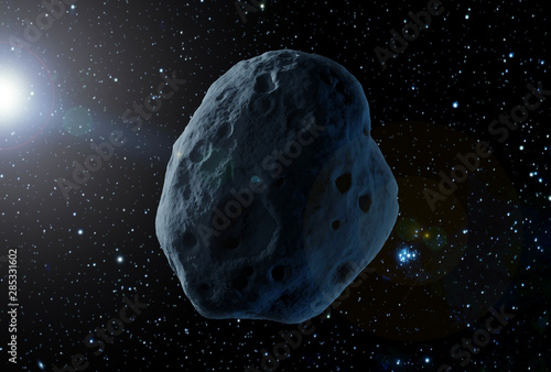 A huge asteroid in space, on a dark background.  Elements of this image were furnished by NASA photo