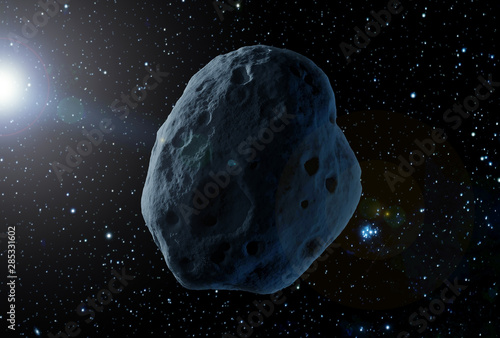 A huge asteroid in space, on a dark background.  Elements of this image were furnished by NASA