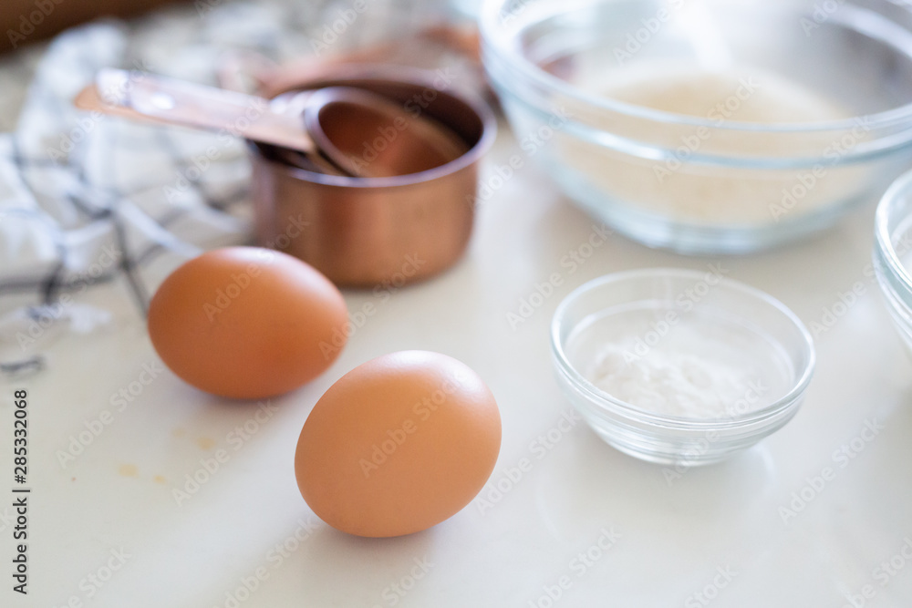 Cake ingredients, eggs, sugar, and baking soda Cake ingredients, eggs, sugar, and baking soda