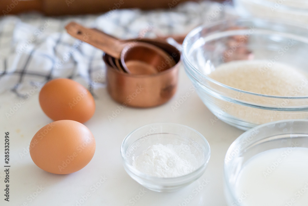 Cake ingredients, eggs, sugar, and baking soda Cake ingredients, eggs, sugar, and baking soda
