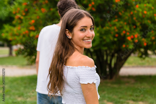 Young couple walking in park photo