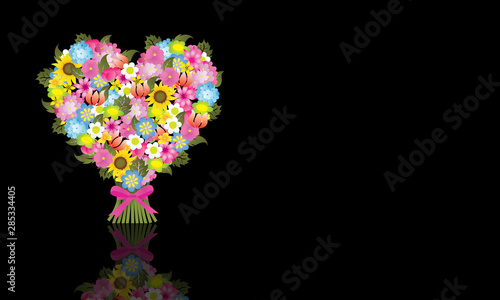Heart illustration made with flowers on dark background