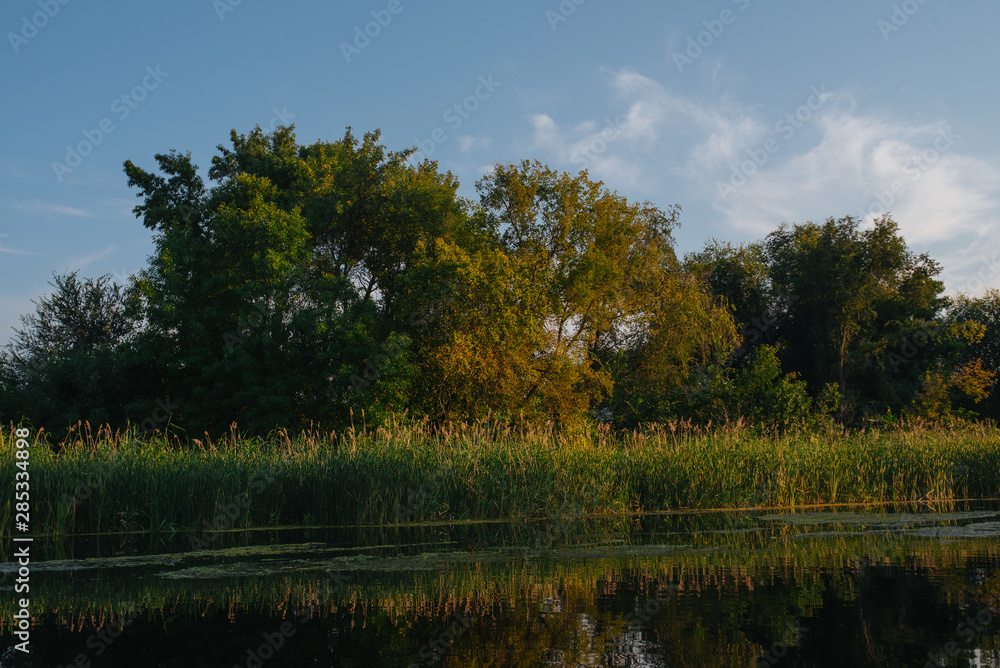 Obraz premium Landscape of nature series. Sunset time on the river.