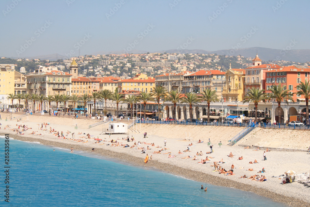 Beach of Nice city and promenade des Anglais along seafront, French Riviera, France Beach of Nice city and promenade des Anglais along seafront, French Riviera, France