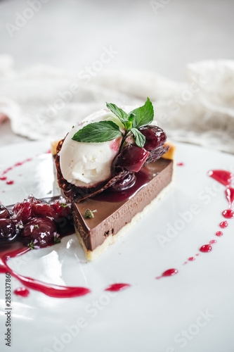 Fototapet Chocolate Custard Tart Dessert with Concord Grape Compote and Vanilla Chantilly