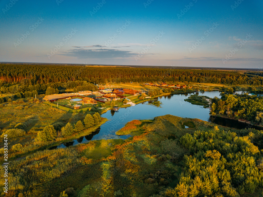 Rural landscape. Forest lake, aerial view from drone