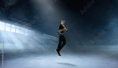 Photography Figure skating couple in professional ice arena.