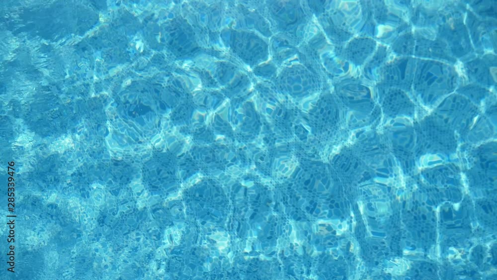 Beautiful turquoise waters in a swimming pool in summer in slow motion Beautiful turquoise waters in a swimming pool in summer in slow motion