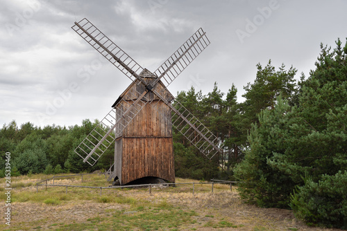Old wooden windmill in The Folk Culture Museum in Osiek by the river Notec, the open-air museum presents polish folk culture. Poland, Europe