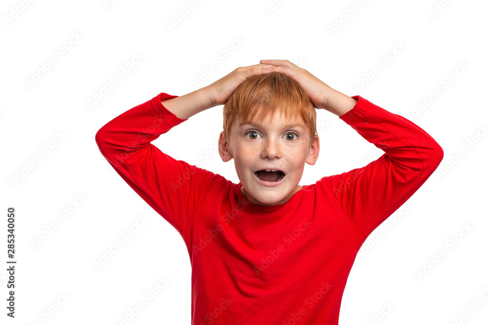 Attractive red-haired boy emotionally reacts to the event. Attractive red-haired boy emotionally reacts to the event.