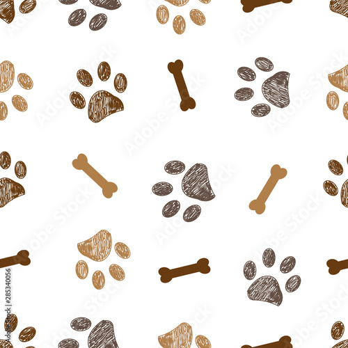 Seamless pattern for textile design. Brown doodle paw print and bones pattern background